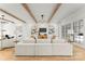Bright living room with wood beam ceiling, modern lighting, and comfortable seating at 4142 Pineview Rd, Charlotte, NC 28211