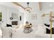 Bright living room boasts a fireplace, hardwood floors, exposed wood beams and modern decor at 4142 Pineview Rd, Charlotte, NC 28211