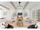 Inviting living room with wood beam ceiling, modern lighting, and comfortable seating at 4142 Pineview Rd, Charlotte, NC 28211