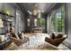 Sophisticated office space with paneled walls, a stylish light fixture, large windows and wood flooring at 4142 Pineview Rd, Charlotte, NC 28211