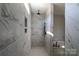 Modern shower in bathroom features rain shower head and sleek marble tile surround at 1405 Coppergate Dr, Salisbury, NC 28147