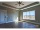 Bright bedroom featuring large windows and ceiling fan at 1405 Coppergate Dr, Salisbury, NC 28147