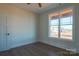Simple bedroom with wood-look floors and a large window at 1405 Coppergate Dr, Salisbury, NC 28147