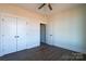 Bedroom with wood-look floors and double doors at 1405 Coppergate Dr, Salisbury, NC 28147