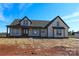 Charming new construction home with a covered porch and stylish architectural details at 1405 Coppergate Dr, Salisbury, NC 28147