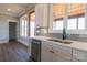 Bright kitchen with tile backsplash, quartz counters, and stainless steel appliances at 1405 Coppergate Dr, Salisbury, NC 28147