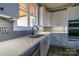 Modern kitchen with white cabinets, quartz countertops, and subway tile backsplash at 1405 Coppergate Dr, Salisbury, NC 28147