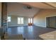 Open living room with hardwood floors, high ceilings, and access to the backyard at 1405 Coppergate Dr, Salisbury, NC 28147