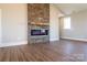 Living room featuring a stone fireplace with electric firebox at 1405 Coppergate Dr, Salisbury, NC 28147