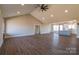 Bright living room with wood floors, fireplace, and open to kitchen at 1405 Coppergate Dr, Salisbury, NC 28147