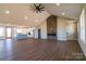 Spacious living room with stone fireplace, wood floors, and vaulted ceiling at 1405 Coppergate Dr, Salisbury, NC 28147