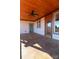Spacious covered porch with ceiling fan and access door at 1405 Coppergate Dr, Salisbury, NC 28147