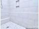 Elegant shower featuring light gray tile walls and decorative stone floor at 106 Windbluff Ct # 163, Statesville, NC 28677