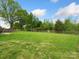 Spacious backyard with a wooden fence and lush green grass at 2165 Smith Rd # 9, Clover, SC 29710