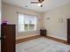 Bright bedroom with wood floors and large window at 2165 Smith Rd # 9, Clover, SC 29710