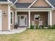 Inviting front porch with rocking chairs and landscaping at 2165 Smith Rd # 9, Clover, SC 29710