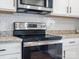 Stainless steel range and microwave in a modern kitchen at 2165 Smith Rd # 9, Clover, SC 29710