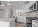 Bright kitchen with stainless steel appliances, white cabinetry, and modern lighting at 4210 Alexander View Dr # 38, Charlotte, NC 28226