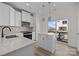 Bright kitchen with white cabinets, stainless steel appliances, and island at 4210 Alexander View Dr # 38, Charlotte, NC 28226