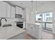 Modern kitchen with stainless steel appliances, quartz countertops and wood-look floors at 4214 Alexander View Dr # 39, Charlotte, NC 28226