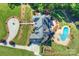 Aerial view showcasing the home's design, pool, and landscaping at 525 Lake Lynn Rd, Concord, NC 28025