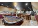 Entertaining game room with a craps table, bar seating, and vintage movie decor at 525 Lake Lynn Rd, Concord, NC 28025