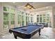 Game room with pool table, stone flooring, and plenty of natural light at 525 Lake Lynn Rd, Concord, NC 28025