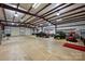 Spacious garage with high ceilings and a variety of vehicles stored inside at 525 Lake Lynn Rd, Concord, NC 28025