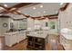 Large kitchen with island, white cabinets, and hardwood floors at 525 Lake Lynn Rd, Concord, NC 28025