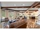 Open-concept living room features hardwood floors, wood-beamed ceilings, and seamless flow into the kitchen at 525 Lake Lynn Rd, Concord, NC 28025