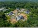 Aerial view of new construction houses with varied styles in a verdant, planned community at 8022 Litaker Manor Ct, Charlotte, NC 28270