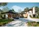 Stunning modern home with a detached garage, a manicured lawn, and a circular driveway at 8022 Litaker Manor Ct, Charlotte, NC 28270