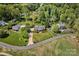 Aerial view featuring multiple homes on lush, green lawns and mature trees at 218 Fairway Dr, Shelby, NC 28150