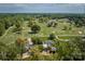 Aerial view of a beautiful property on a golf course with lush greenery and mature trees at 218 Fairway Dr, Shelby, NC 28150