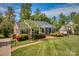 Charming brick home with mature landscaping and inviting curb appeal on a sunny day at 218 Fairway Dr, Shelby, NC 28150