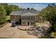 Expansive brick home showcasing a circular driveway, garage, and well-maintained landscaping at 218 Fairway Dr, Shelby, NC 28150