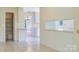 Bright kitchen area offering tiled floors, a pantry, and a breakfast bar with views to the backyard at 218 Fairway Dr, Shelby, NC 28150