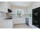 Charming, well-maintained kitchen with white cabinetry and stainless steel appliances at 218 Fairway Dr, Shelby, NC 28150