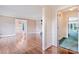 Open-concept living space showcasing hardwood floors, moldings, and a glimpse into other rooms at 218 Fairway Dr, Shelby, NC 28150