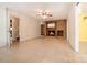 The living room features a wood-burning fireplace, tile floors, and views into the kitchen at 218 Fairway Dr, Shelby, NC 28150