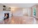 Spacious living room with hardwood floors, fireplace, and plenty of natural light at 218 Fairway Dr, Shelby, NC 28150