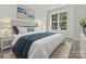 Well-lit bedroom with a queen-size bed and neutral decor at 2121 Acclaim St, Charlotte, NC 28205