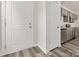 White door and hardwood floors in entryway, kitchen view at 2125 Acclaim St, Charlotte, NC 28205