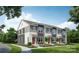 Three-unit townhome building with gray siding and red doors at 2125 Acclaim St, Charlotte, NC 28205