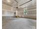 Unfinished garage with concrete floor and overhead door at 2125 Acclaim St, Charlotte, NC 28205