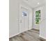 Bright and airy entryway with white door, large window, and wood-look flooring at 2137 Acclaim St, Charlotte, NC 28205