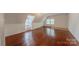 Bright attic bedroom with hardwood floors and window seat at 404 W Kerr St, Salisbury, NC 28144