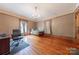 Bedroom with wooden bed, hardwood floors, and home office area at 404 W Kerr St, Salisbury, NC 28144