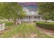 Large two-story house with wraparound porch and landscaped yard at 404 W Kerr St, Salisbury, NC 28144