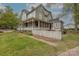 Gray two story home with wrap around porch and white picket fence at 404 W Kerr St, Salisbury, NC 28144